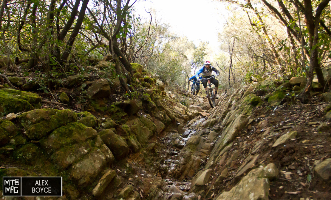 The trail then drops into a wide formed rocky channel that tests all elements of the bike.